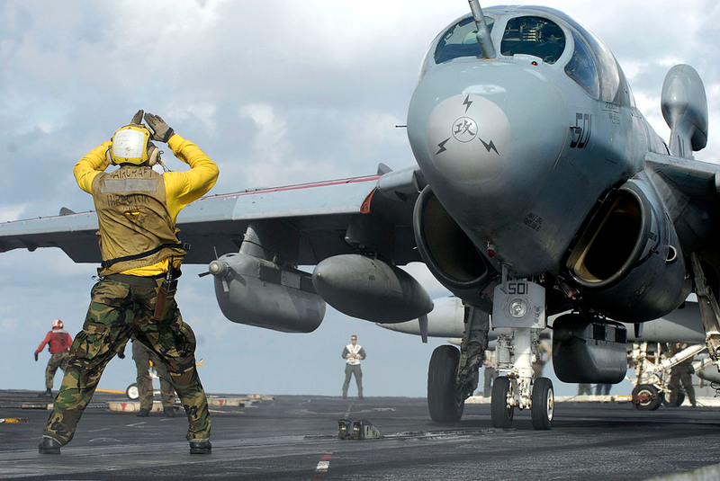 Illustration for article titled Here Is What All Those Colored Shirts Mean On An Aircraft Carrier's Deck